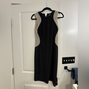 Xscape black illusion dress with rhinestones.
